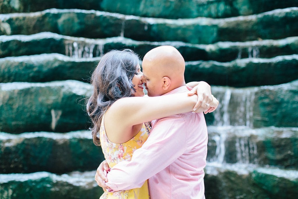 Fine Art Wedding Photography - Lauren Renee Photography Couples embracing in front of a fountain downtown