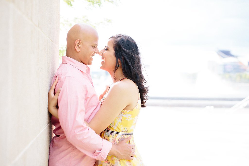 Fine Art Wedding Photography - Lauren Renee Photography Couple kissing against a white stone wall near the point fountain