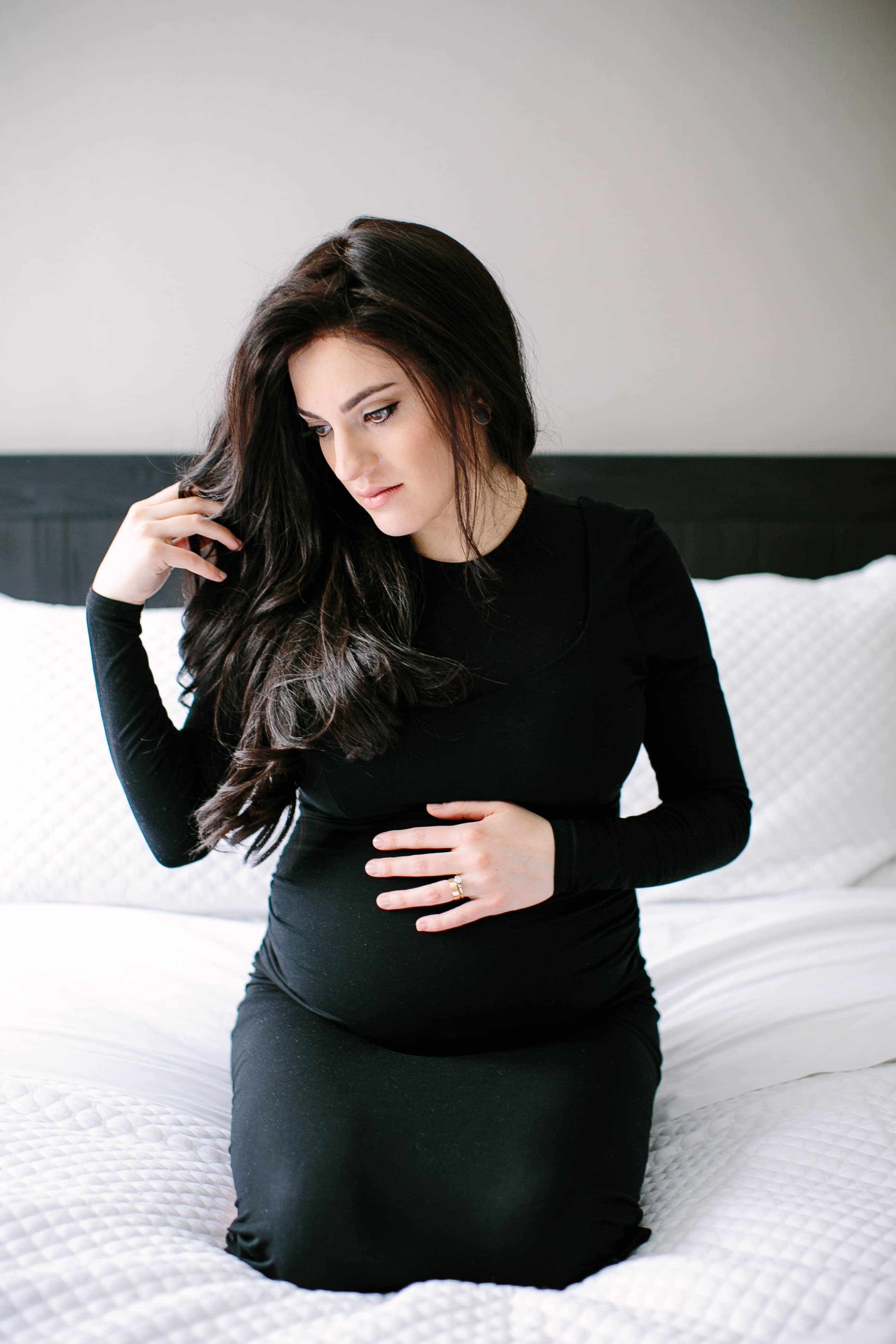 Maternity and Family Session, Fine Art Photography - Lauren Renee Photography pregnant woman sitting on a white bed during maternity photos