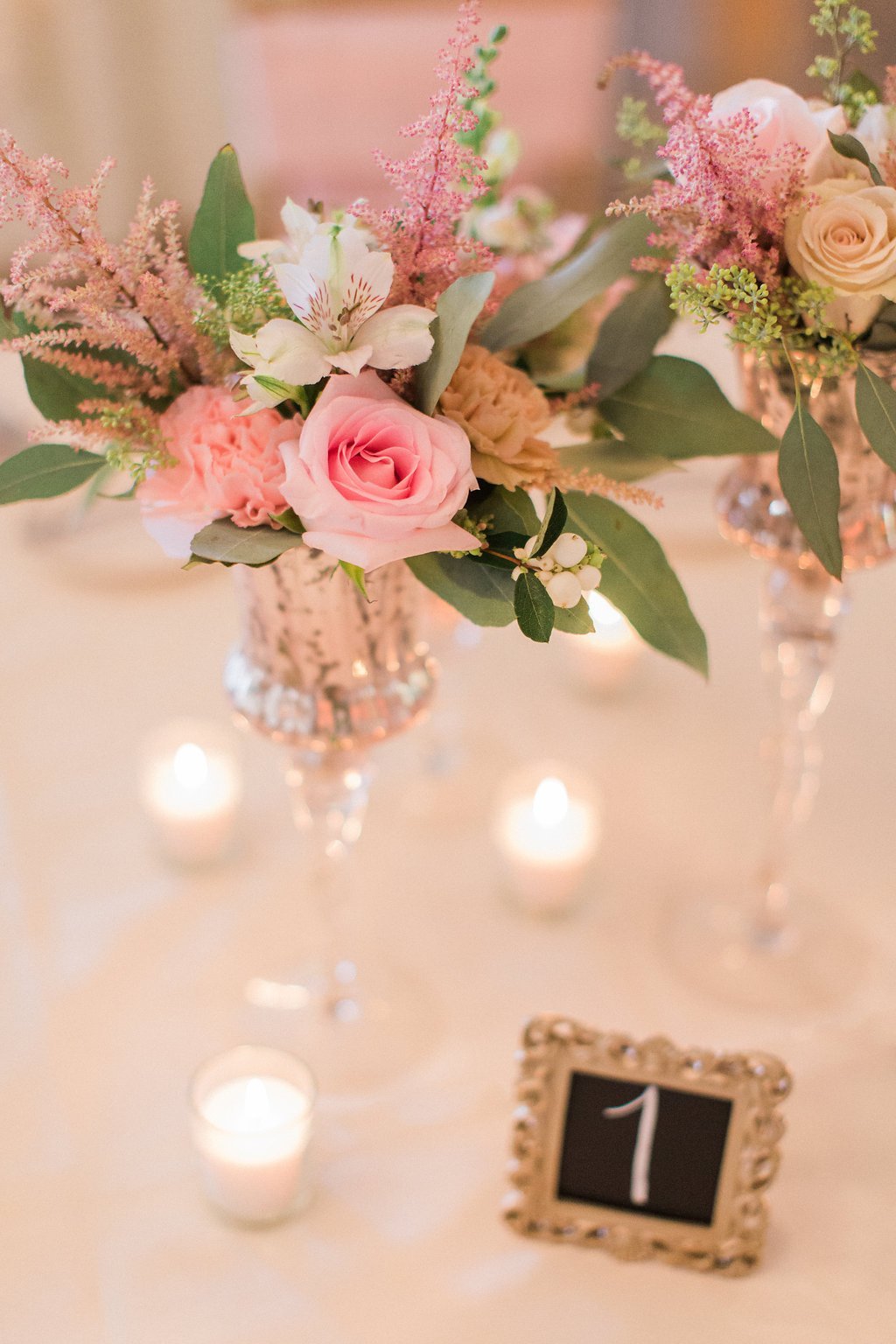Lauren Renee Photography close up of flowers and table decor at wedding reception