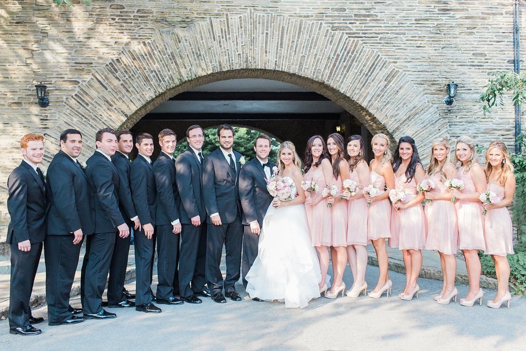 Lauren Renee Photography entire bridal party standing under the archway at Longue Vue Club