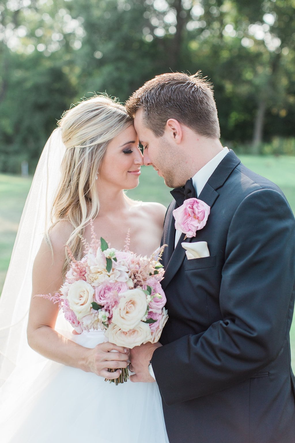Lauren Renee Photography Bride and groom touching noses during portrait session