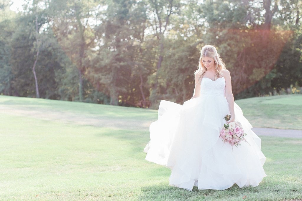 Lauren Renee Photography Bride dancing during her bridal portraits in the sun