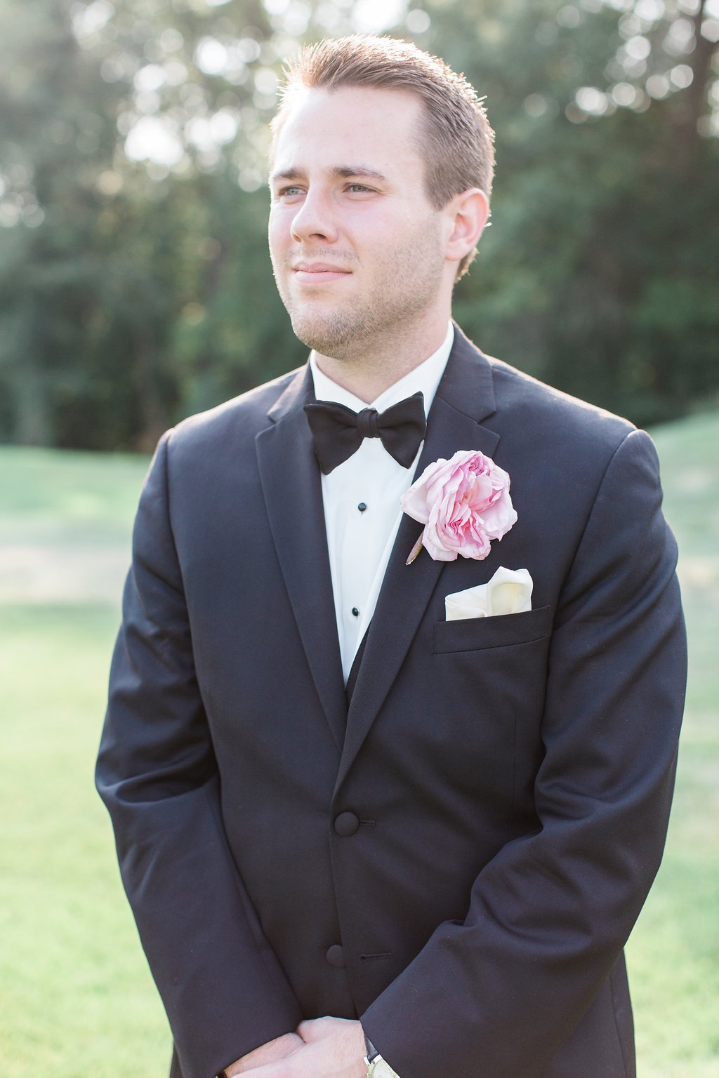 Lauren Renee Photography Groom posing for photos in tuxedo