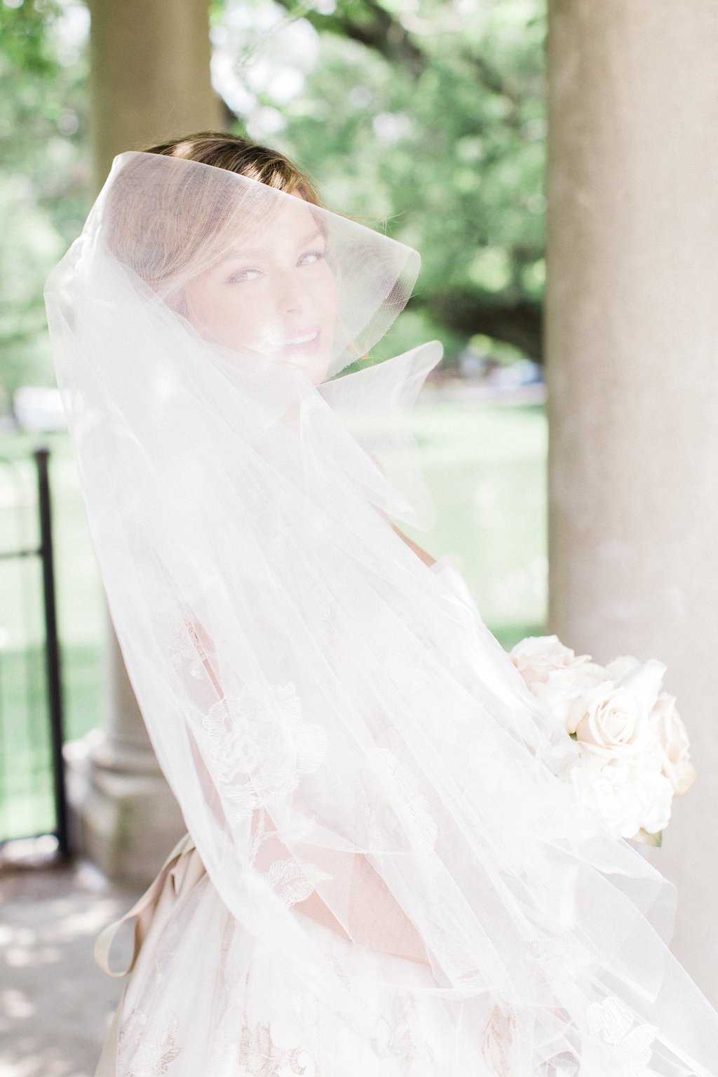 Destination Wedding Photography, Lauren Renee Photography Bride's veil blowing in the wind across her face