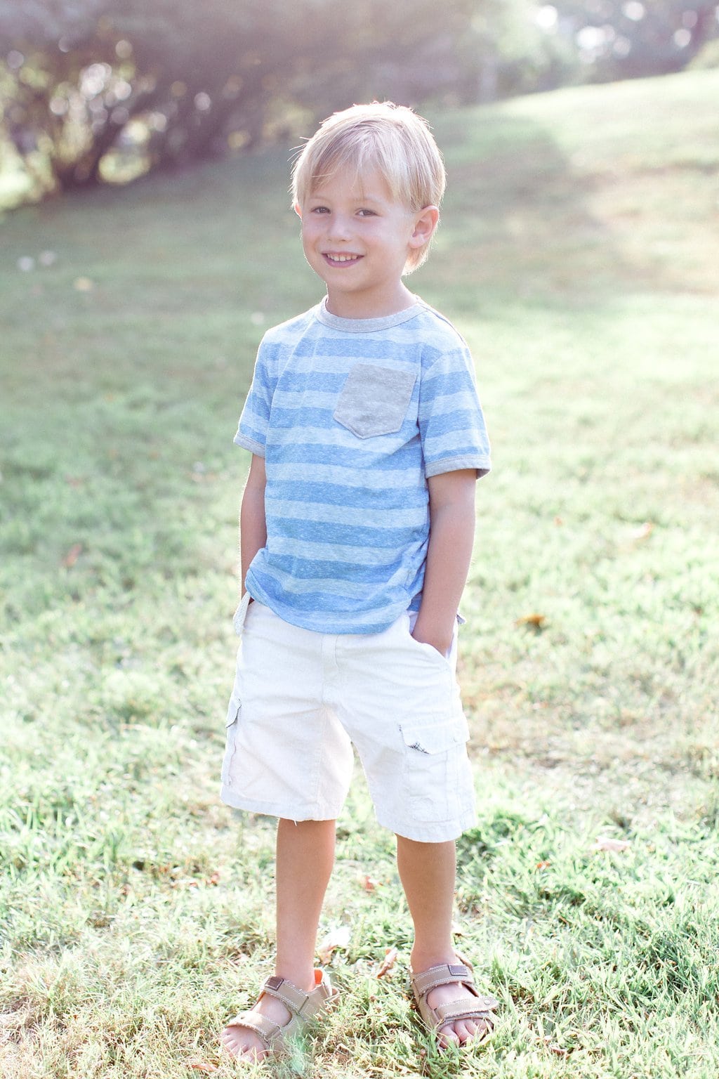 Family - Lauren Renee Photography little boy wearing blue striped shirt and white shorts