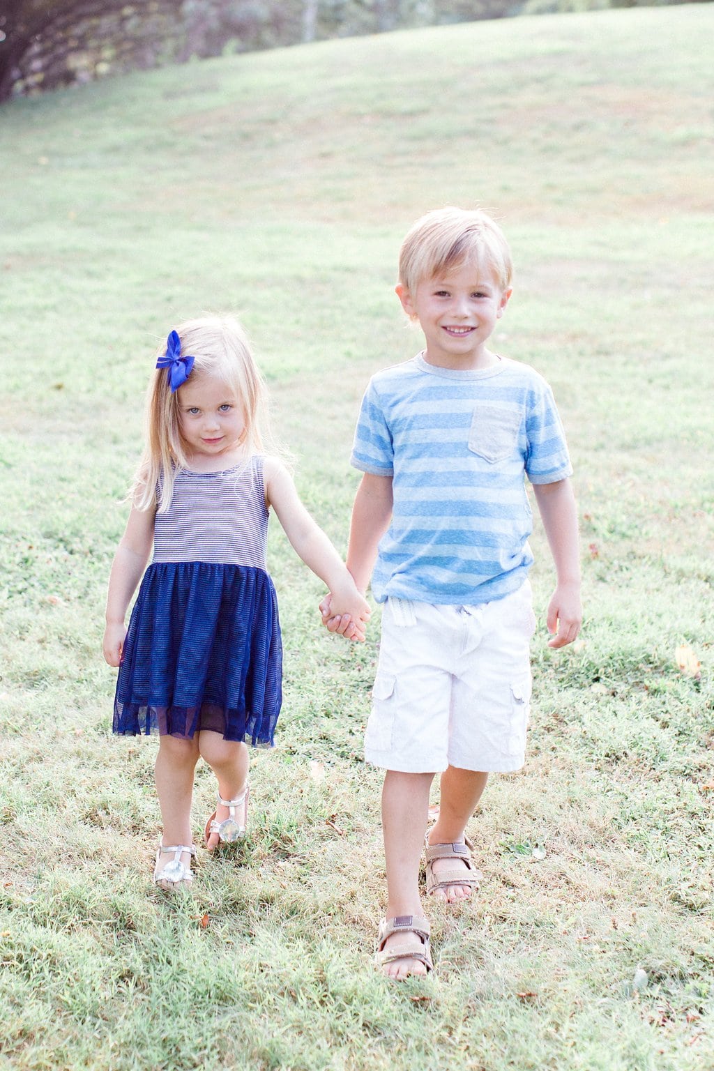 Family - Lauren Renee Photography Brother and sister holding hands during session