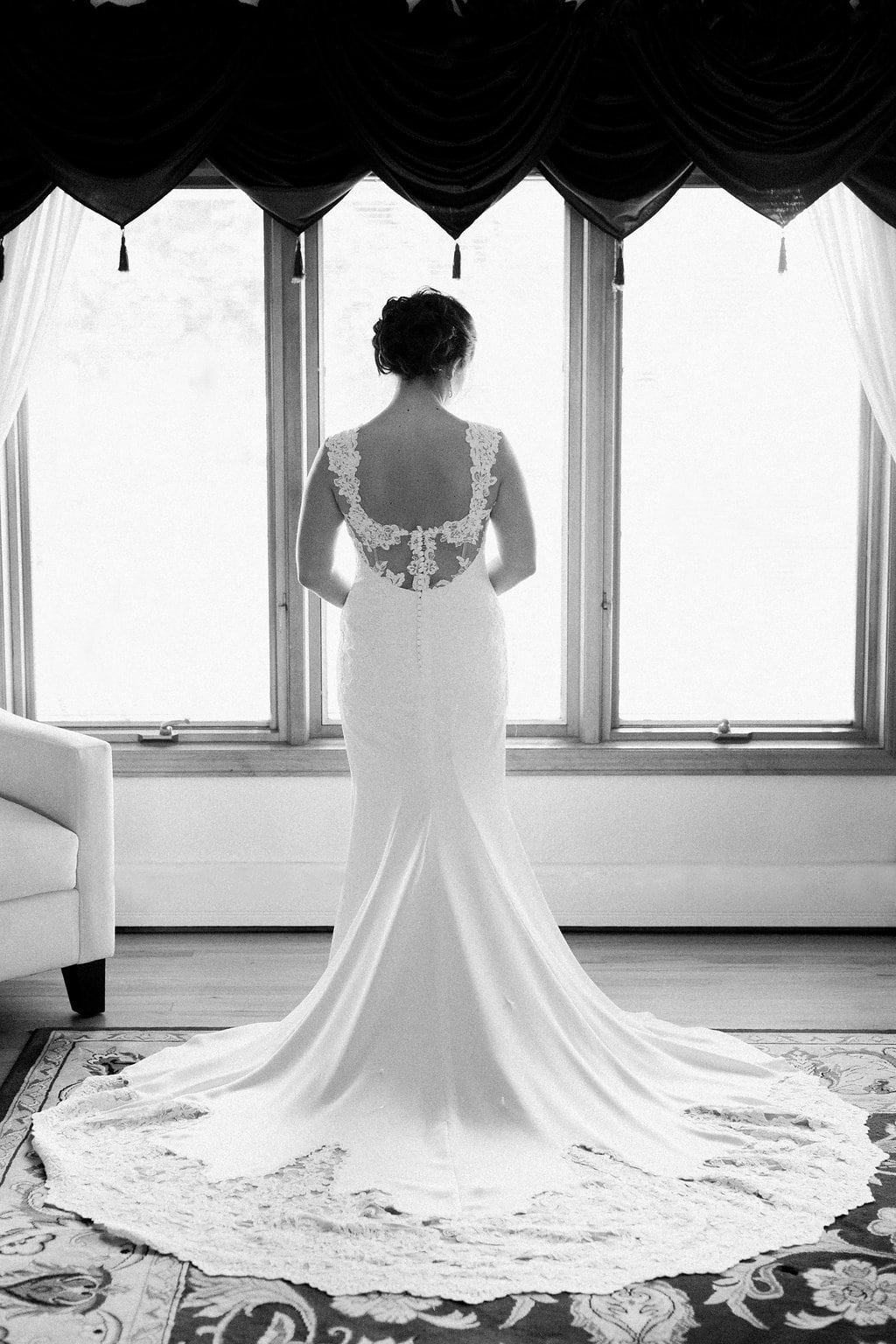 Lauren Renee - Pittsburgh Fine Art Wedding Photography black and white photo of the bride standing in her wedding dress in her childhood home