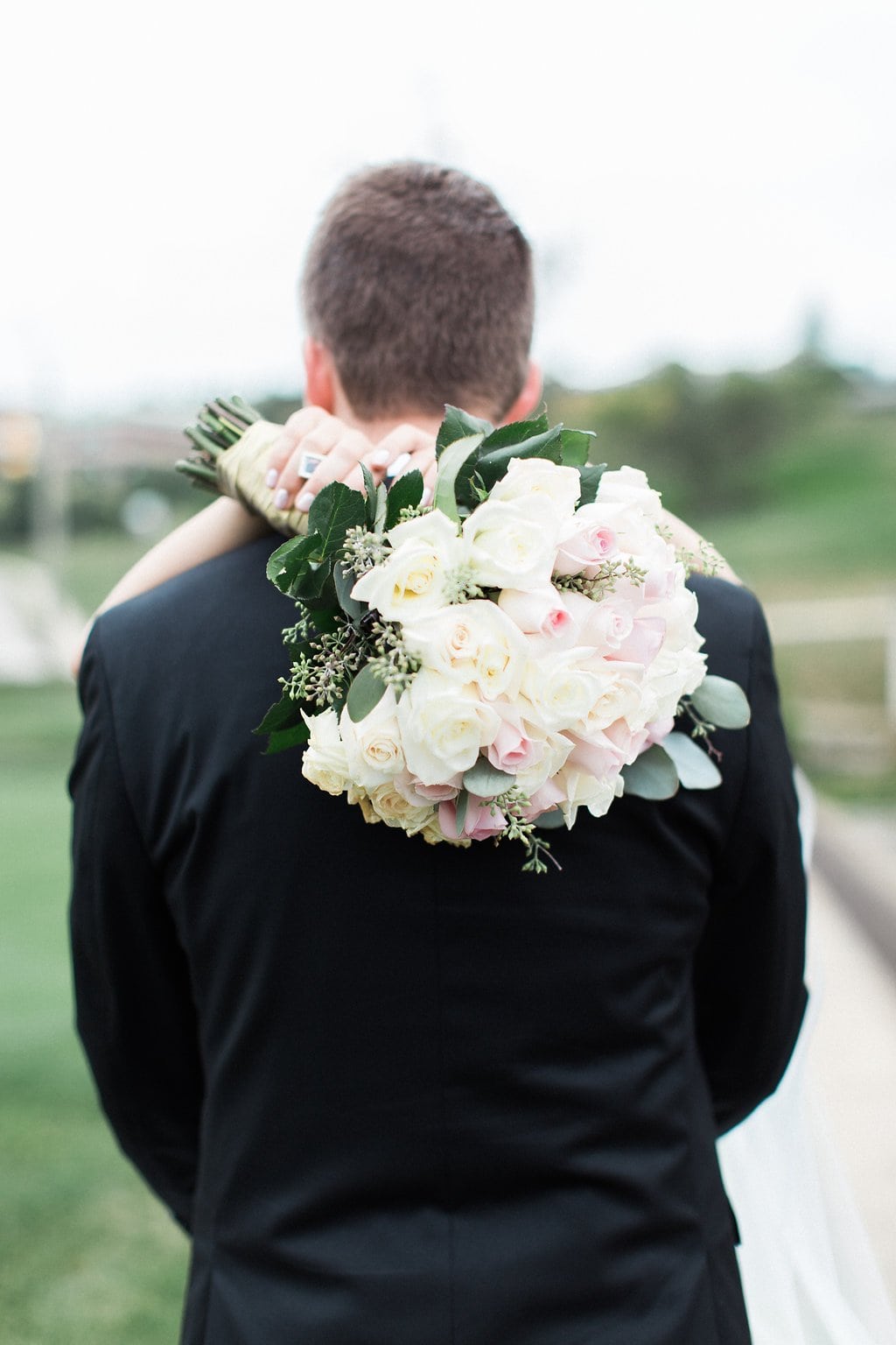 Lauren Renee - Pittsburgh Fine Art Wedding Photography Bride putting her hands over the groom's shoulders with her bouquet