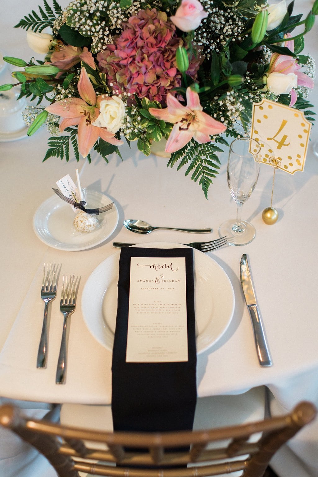 Lauren Renee - Pittsburgh Fine Art Wedding Photography Pink flowers and black napkin accents and gold lettered table numbers for center pieces at reception