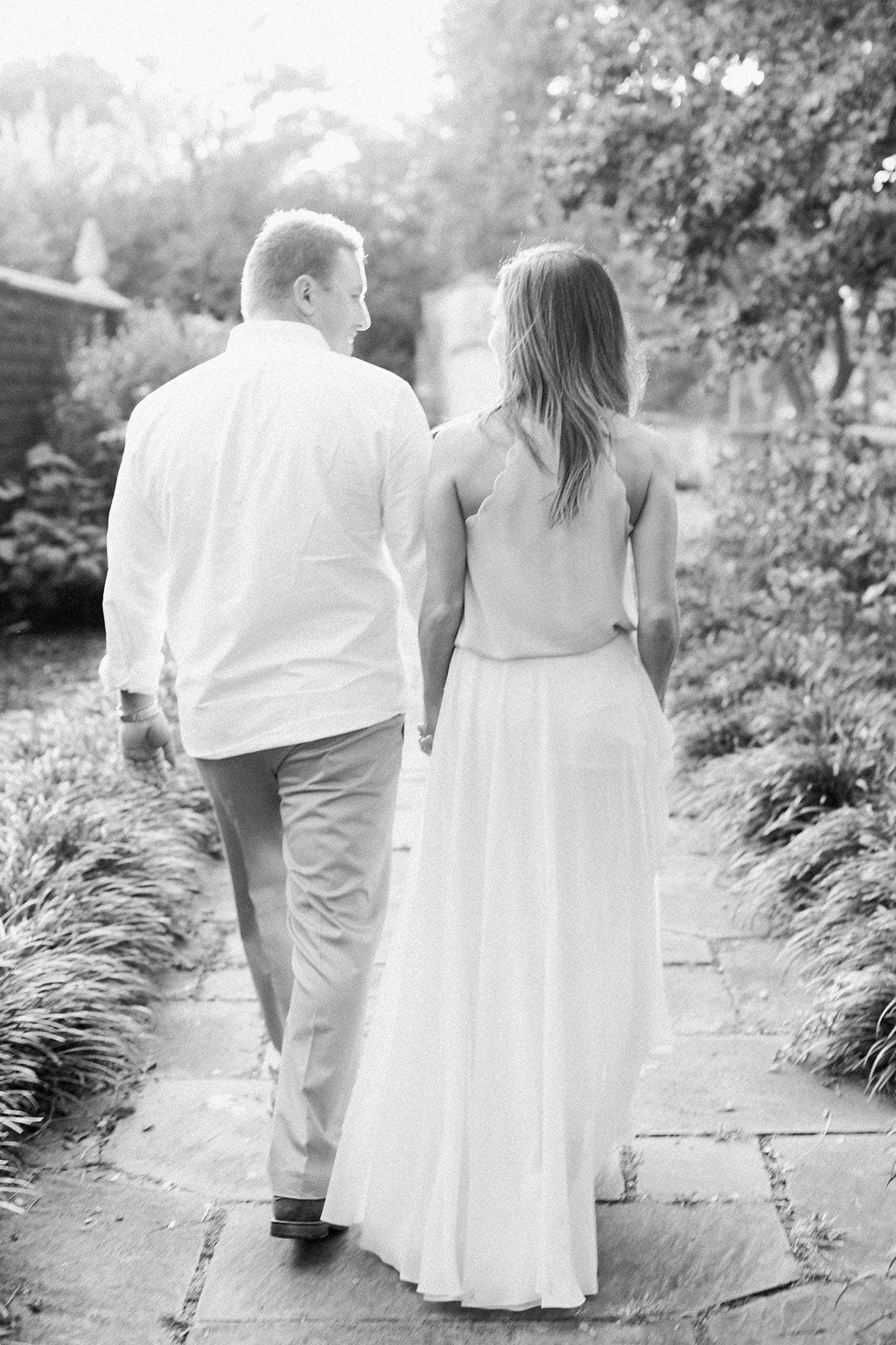 Lauren Renee - Pittsburgh Wedding Photography Black and white photo of couple walking away looking at each other