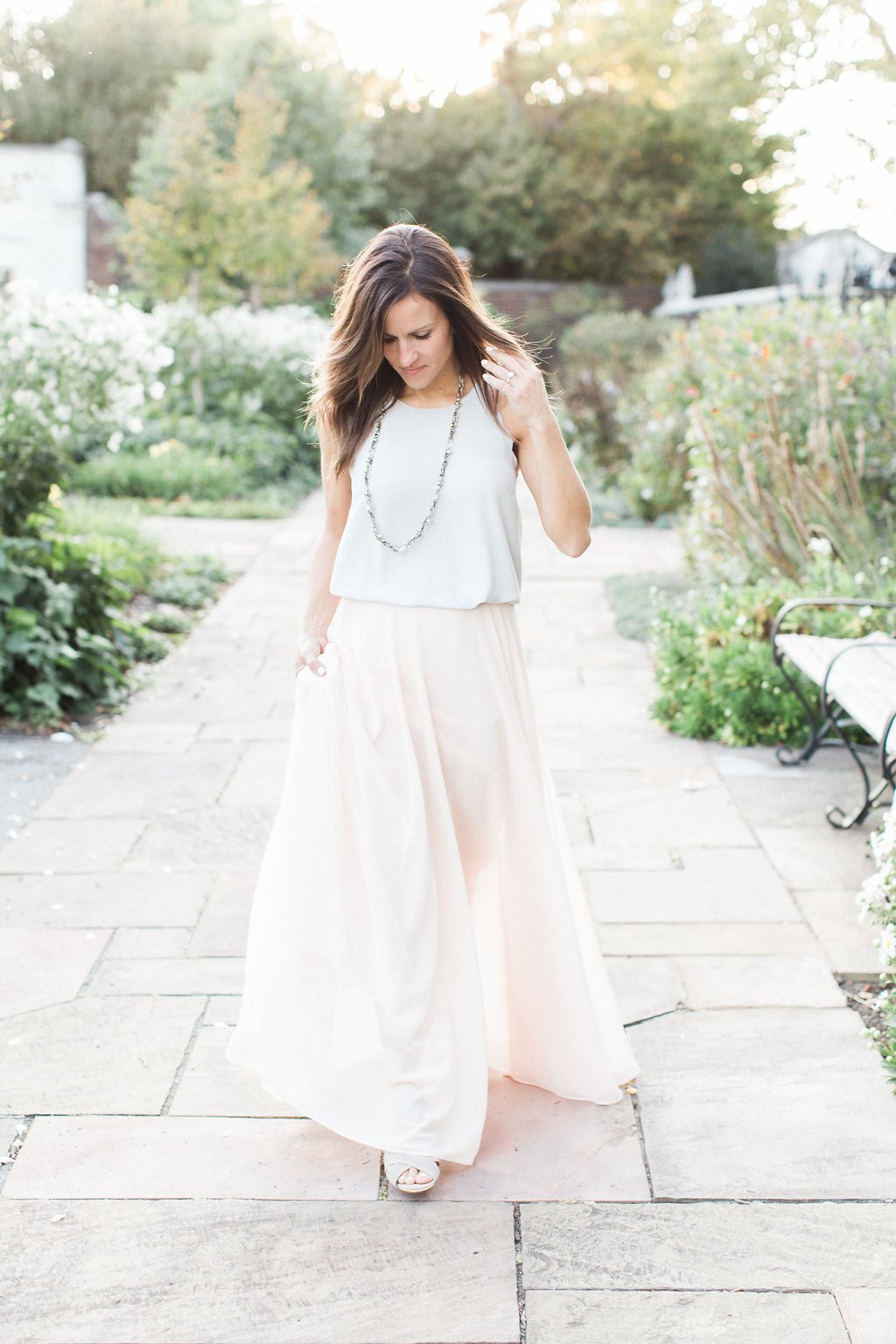 Lauren Renee - Pittsburgh Wedding Photography Bride walking wearing a light grey sleeveless top and flowing light pink skirt