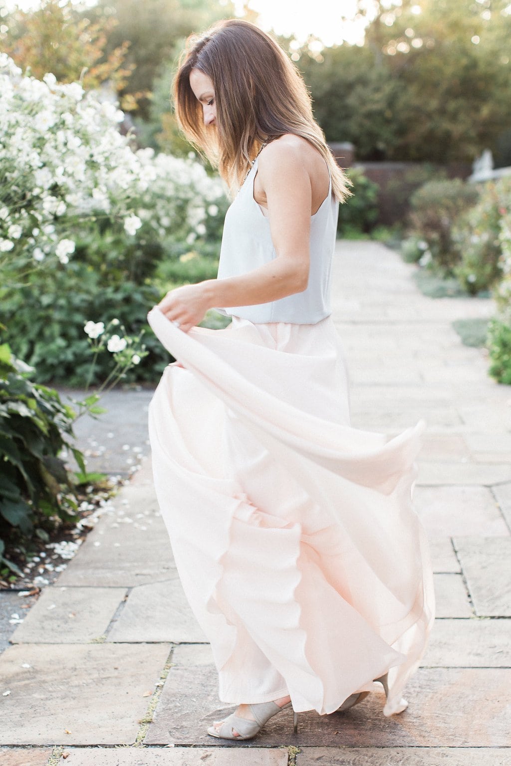 Lauren Renee - Pittsburgh Wedding Photography Bride dancing in the park wearing a light pink flowy skirt and grey sleeveless top