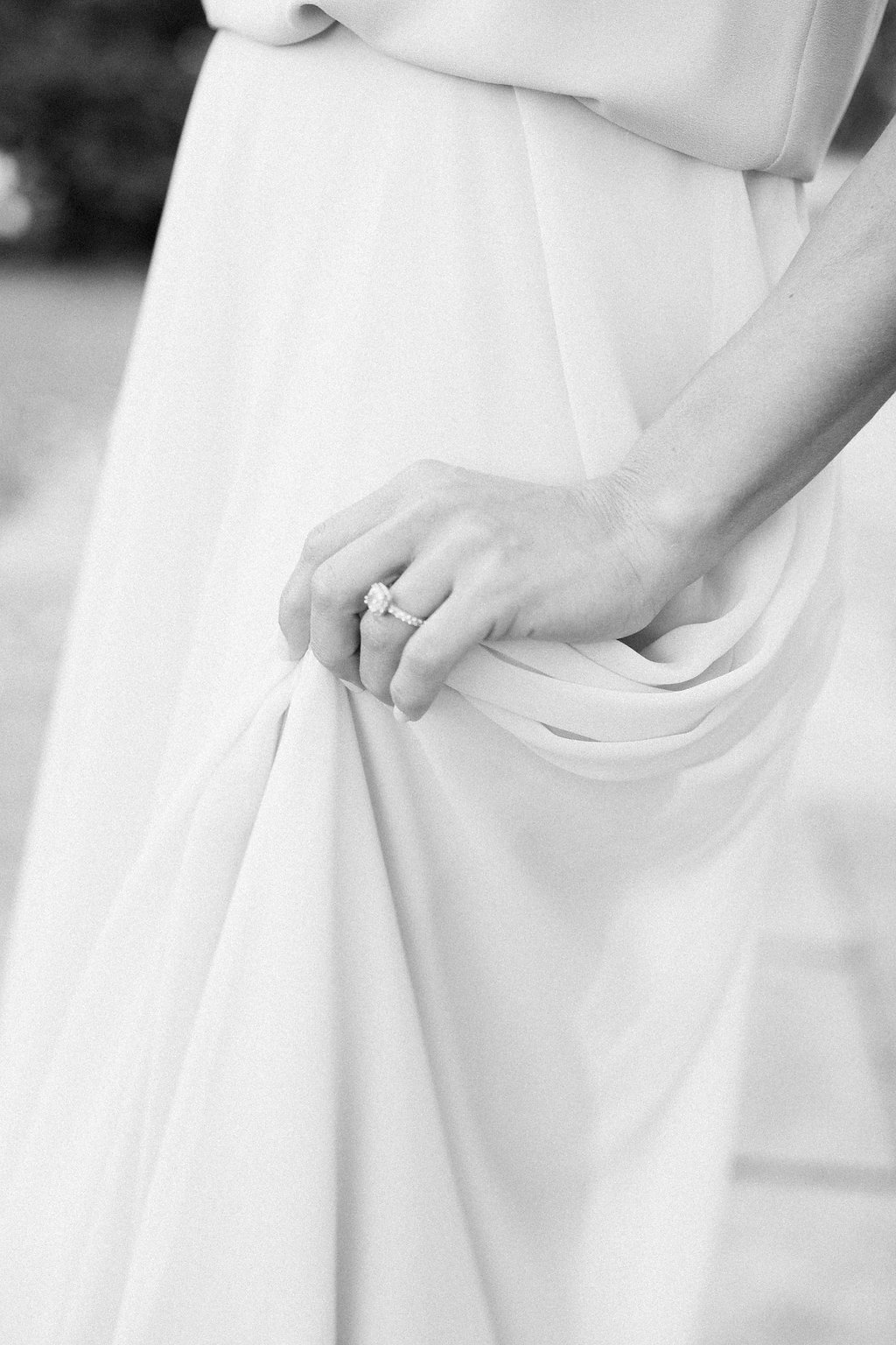 Lauren Renee - Pittsburgh Wedding Photography Close up of woman's engagement ring as she lightly grabs her skirt