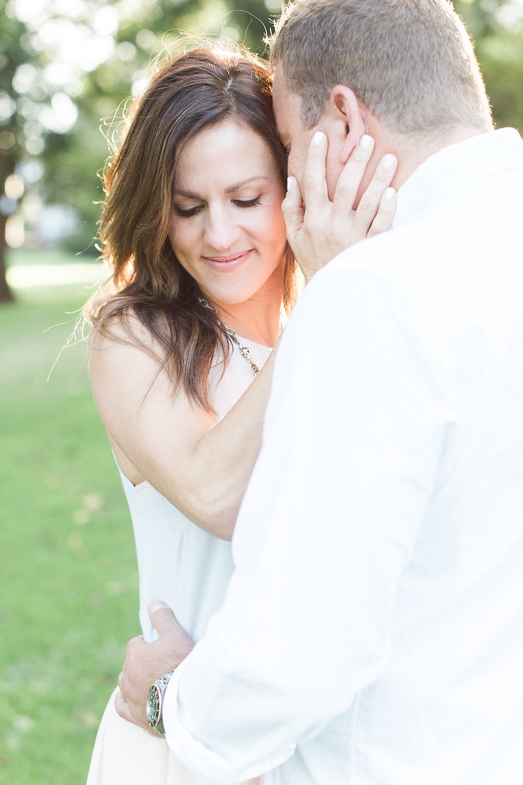 Lauren Renee - Pittsburgh Wedding Photography Couple cuddling during their sun kissed engagement session