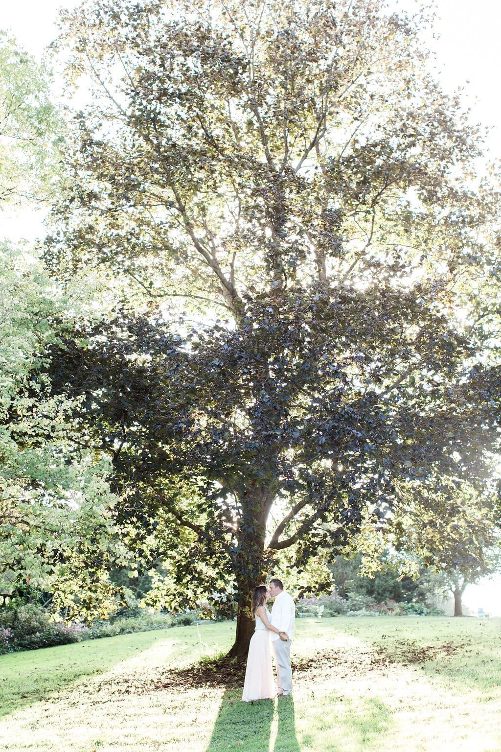 Lauren Renee - Pittsburgh Wedding Photography Couple standing near a tree during their engagement session