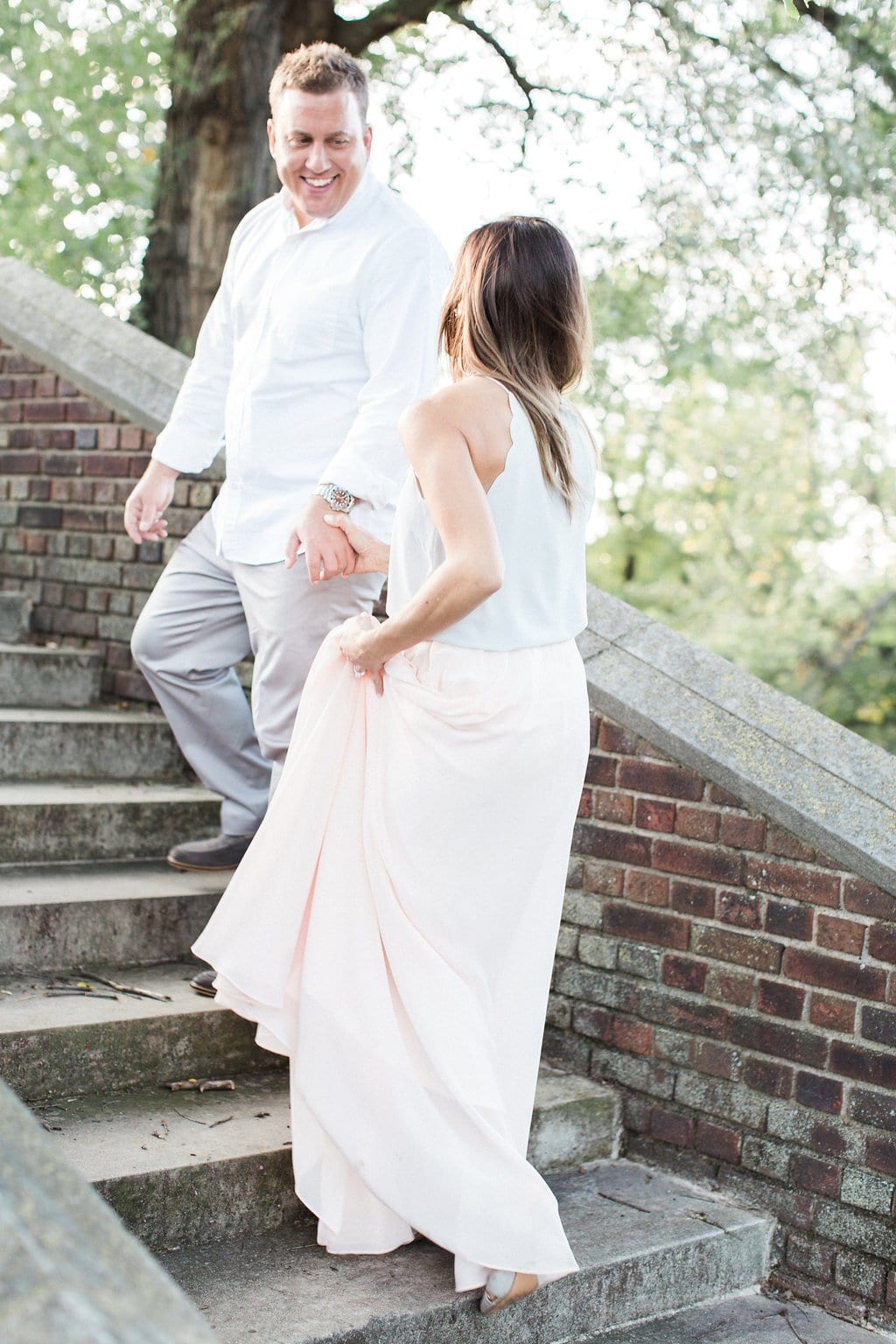 Lauren Renee - Pittsburgh Wedding Photography Couple walking up stone stairs at the walled garden