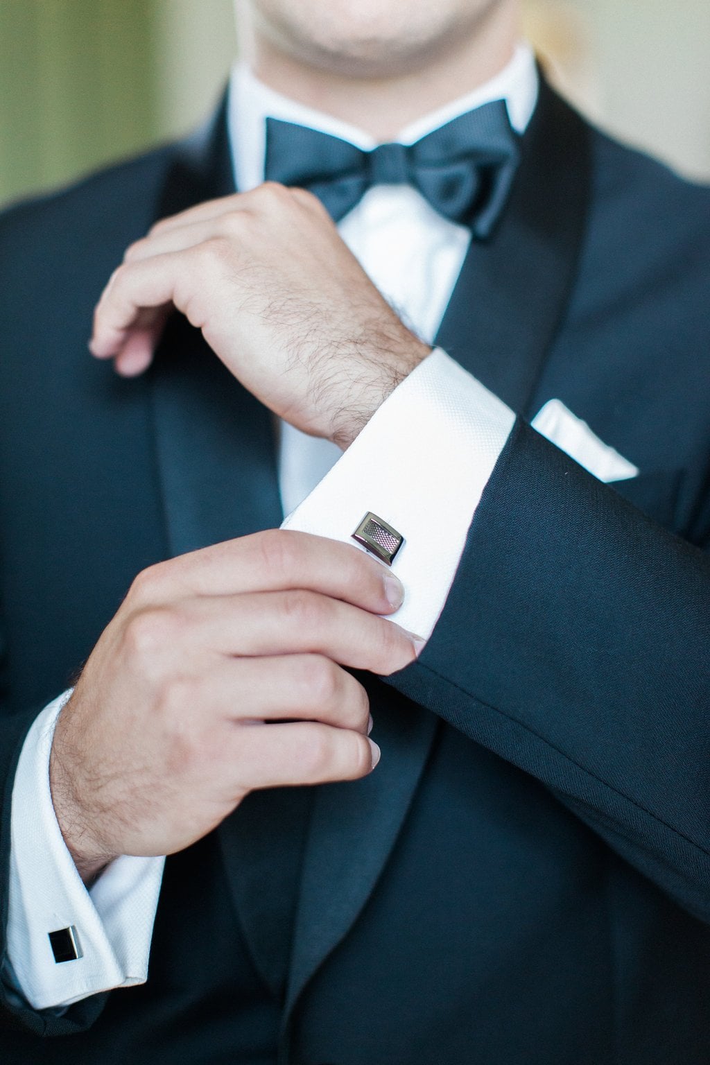 Golf Club Wedding - Lauren Renee Photography Groom putting on cufflinks