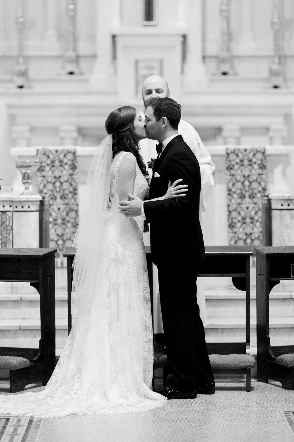 Golf Club Wedding - Lauren Renee Photography Bride and groom first kiss at the church altar
