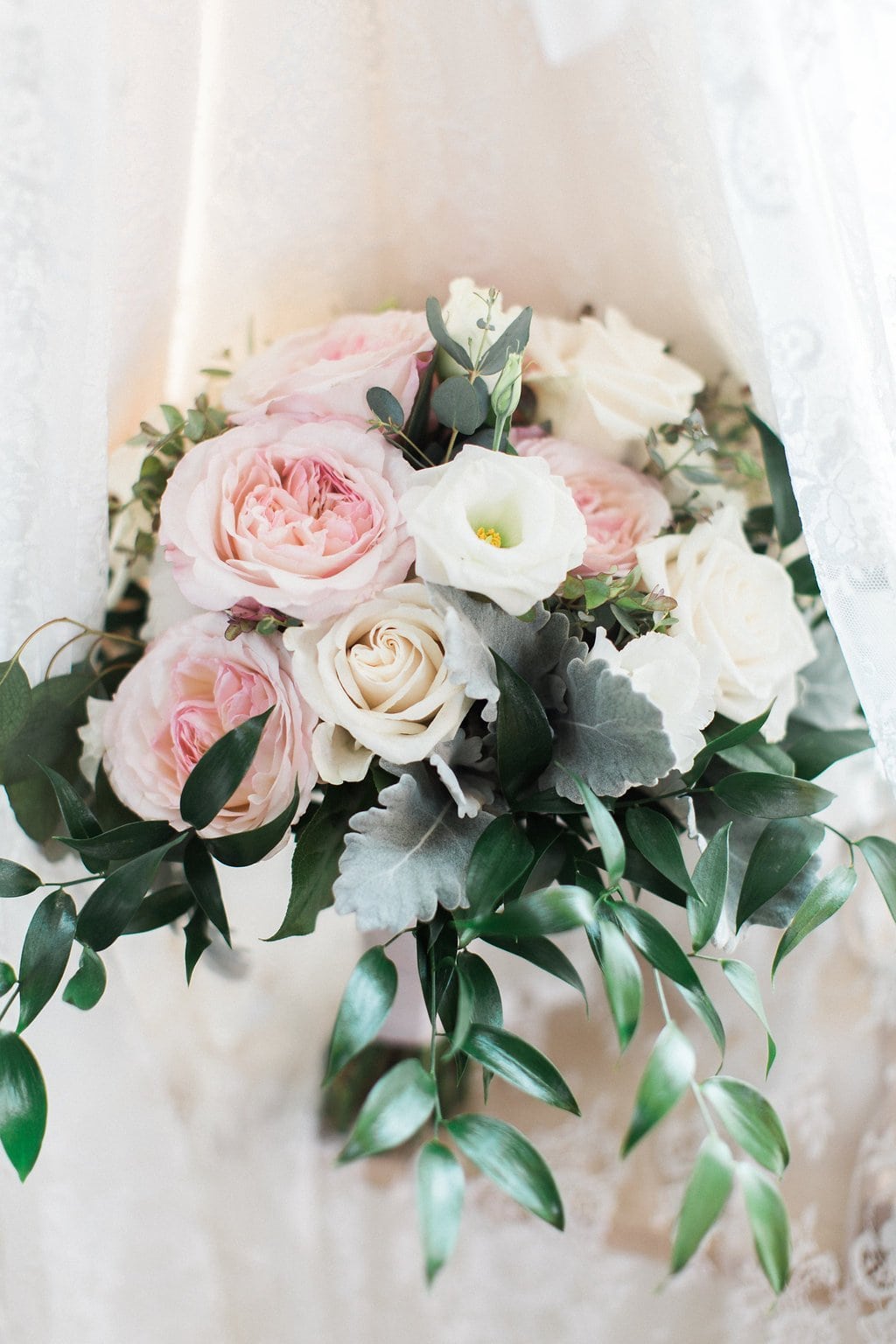 Golf Club Wedding - Lauren Renee Photography Close up of bride's light pink and white bouquet with veil