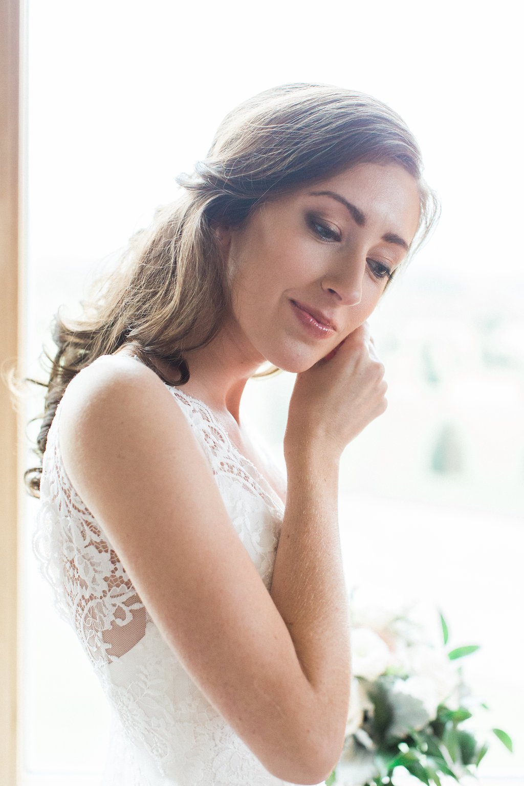 Golf Club Wedding - Lauren Renee Photography Bride putting in earrings