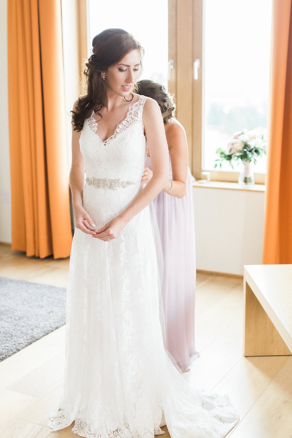 Golf Club Wedding - Lauren Renee Photography Bride getting into her wedding dress