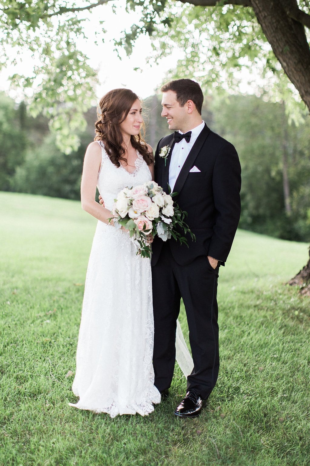 Golf Club Wedding - Lauren Renee Photography bride and groom portraits holding hands and looking at each other