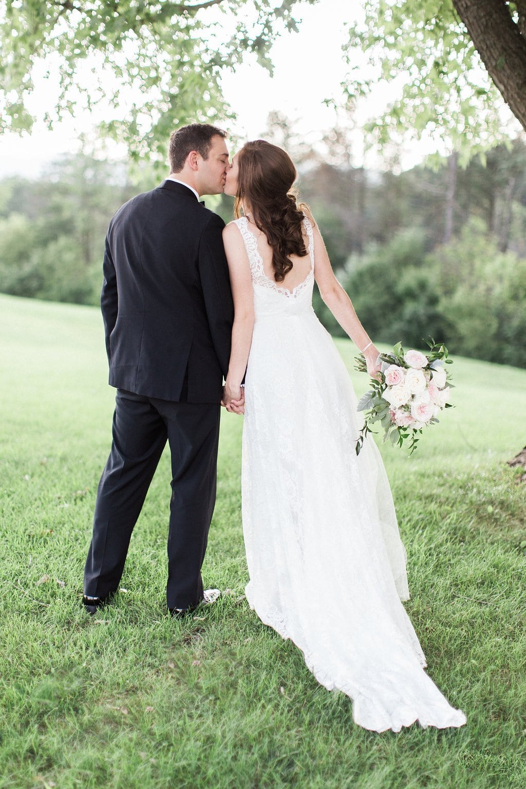 Golf Club Wedding - Lauren Renee Photography Bride and groom portraits of them kissing