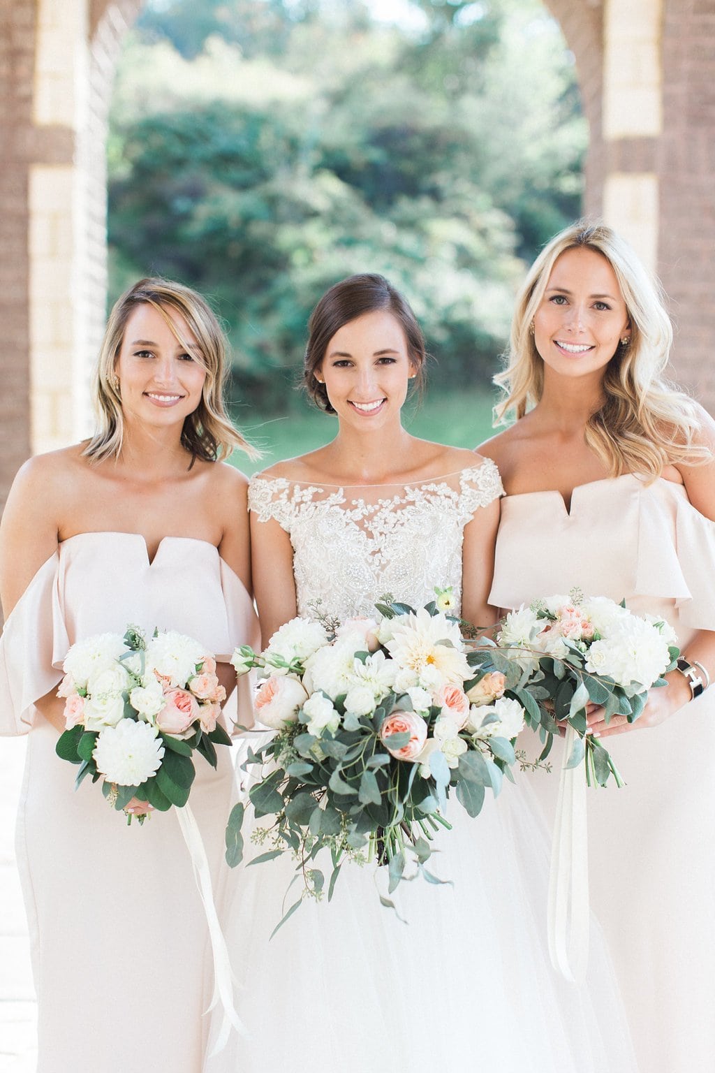 Pittsburgh Wedding - Lauren Renee Photography Bride with her bridesmaids outside of the church