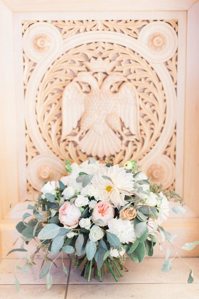 Bride's blush pink and white bouquet photographed inside the church