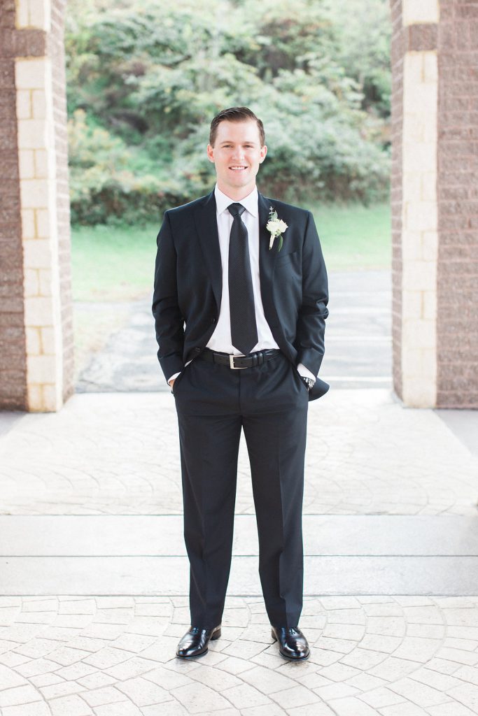 Groom portraits outside All Saints Greek Orthodox Church