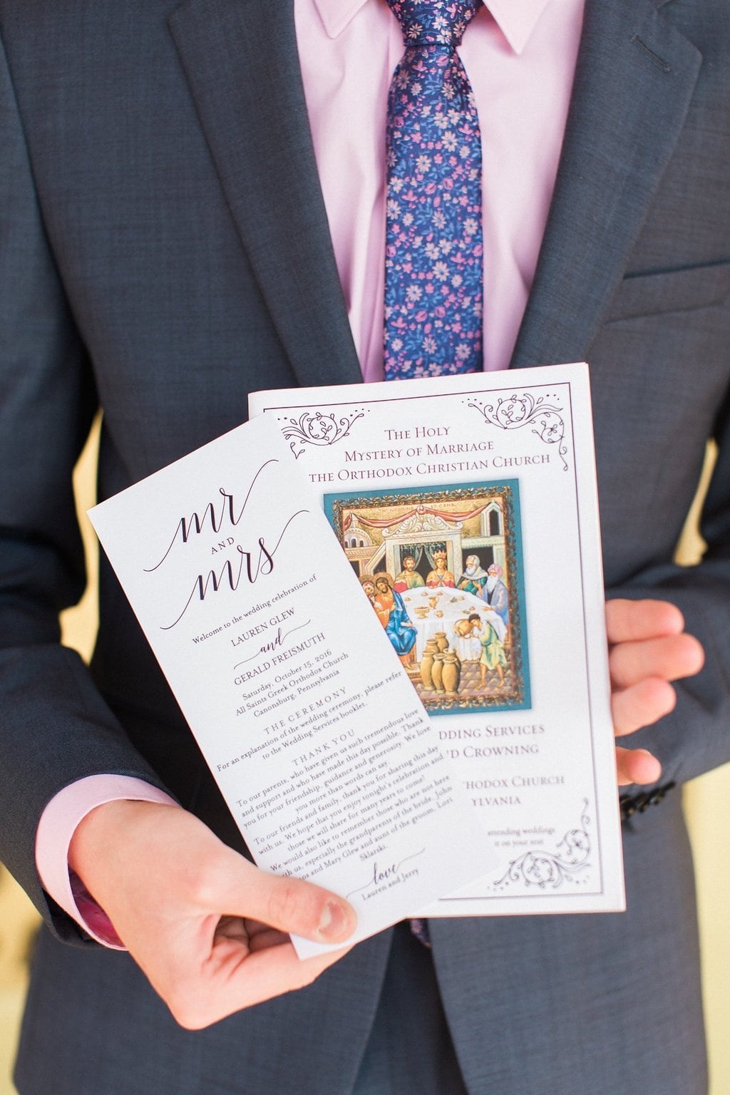 Pittsburgh Wedding - Lauren Renee Photography Wedding Programs held by a groomsman before the wedding ceremony