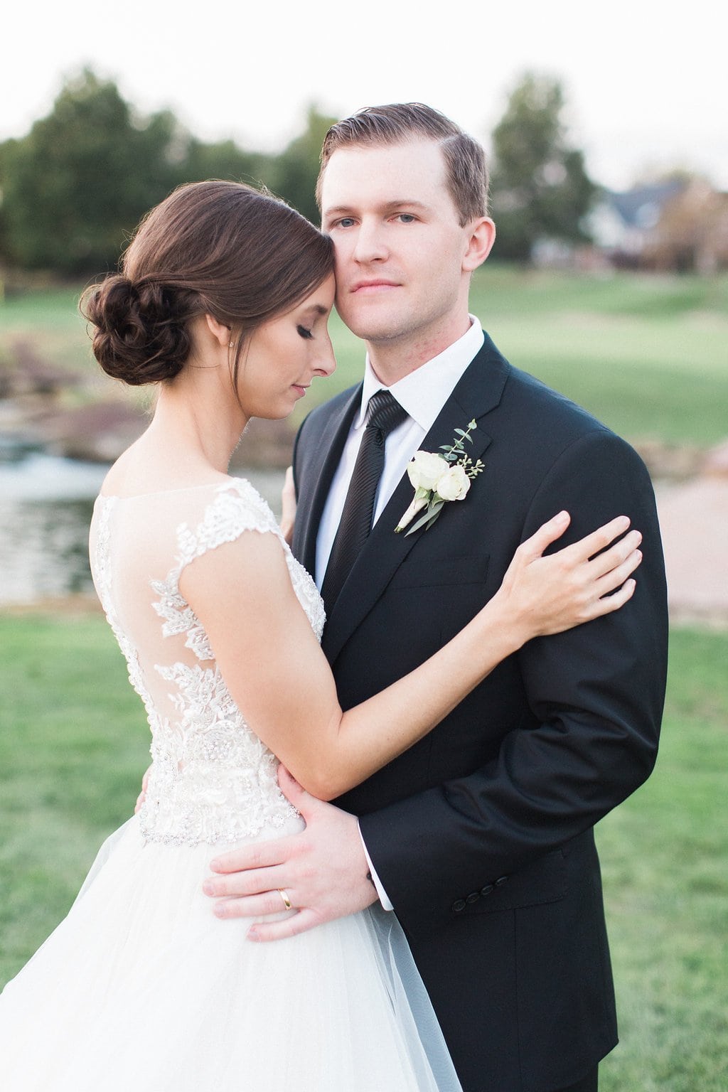 Pittsburgh Wedding - Lauren Renee Photography Bride and Groom embracing in a romantic portrait on the golf course at sunset