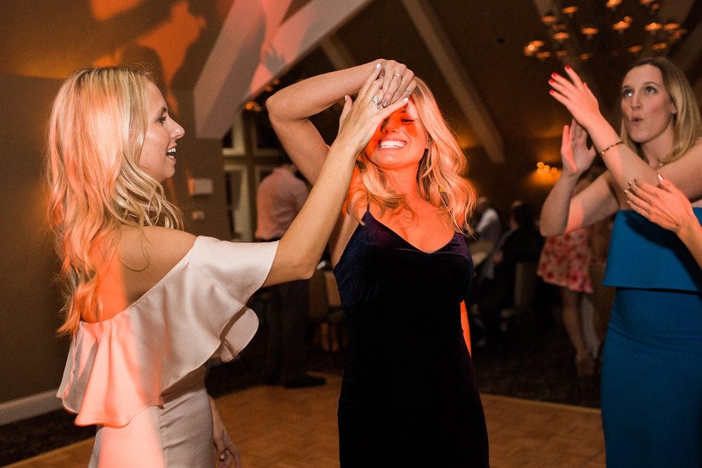 Bridesmaids and guests enjoying the reception and dancing at the Club at Nevillwood