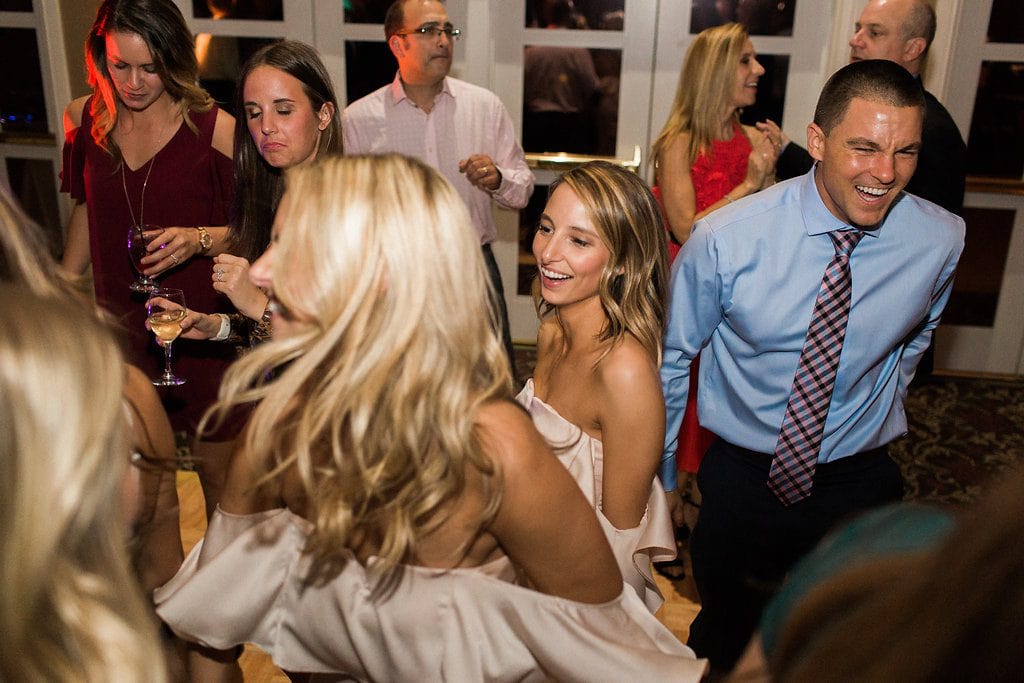 Guests dancing at the reception and enjoying the party and music