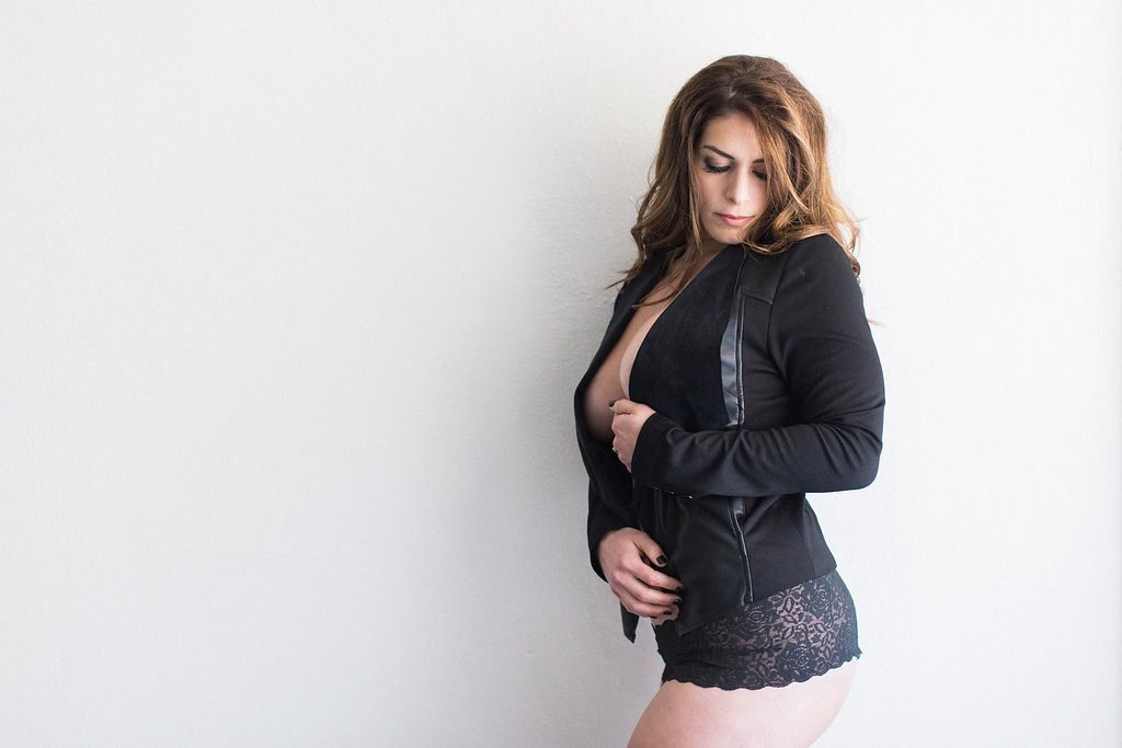 Boudoir image of bride in a black leather jacket posing for photos: Pittsburgh Boudoir Photography