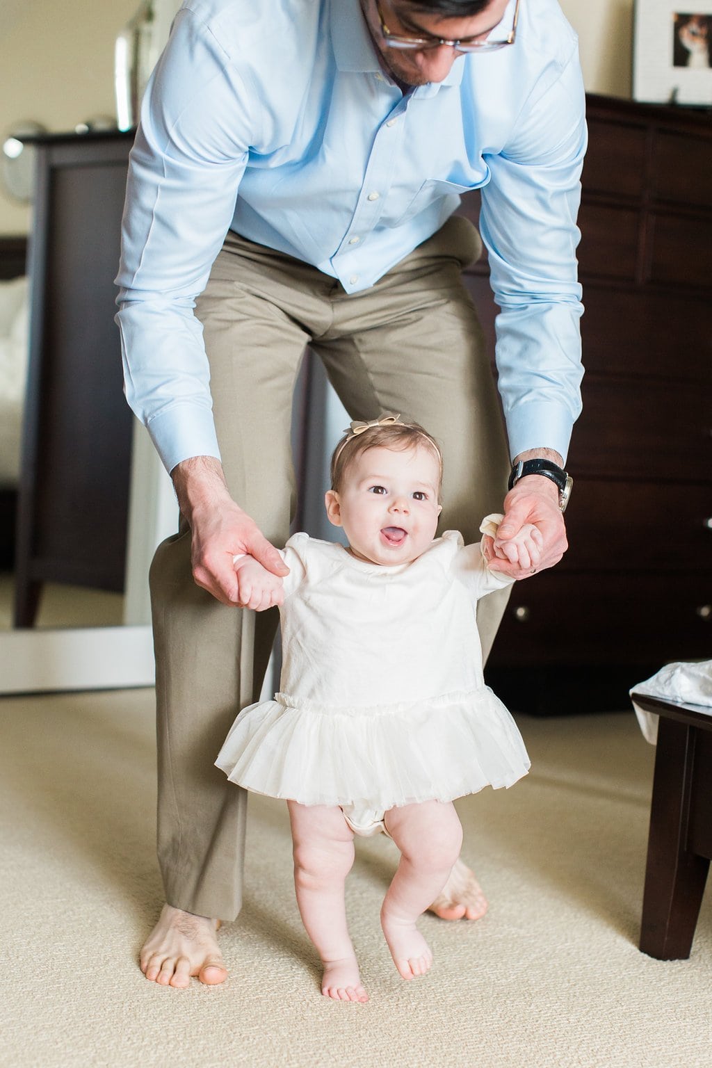 Lifestyle Photography - Lauren Renee Photography Dad walking baby around the room for some fun