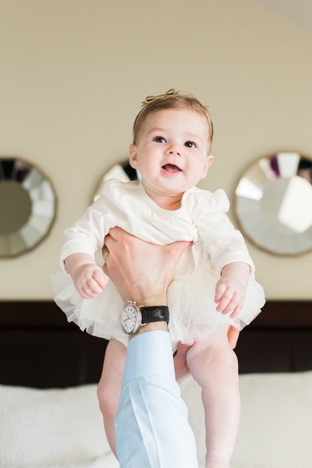 Lifestyle Photography - Lauren Renee Photography Dad holding baby in the air during family photography session