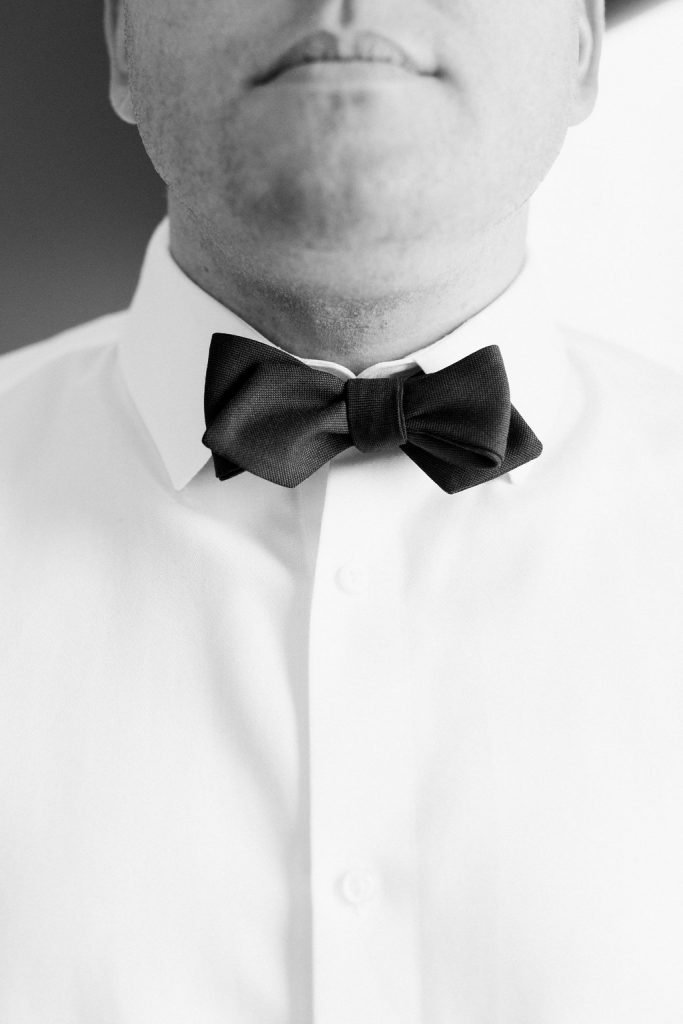 Close up photo of groom's bowtie during getting ready portraits