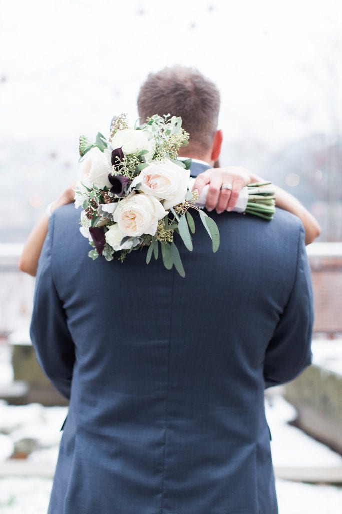 Bride and groom photos with bride's bouquet with blush pink and purple flowers