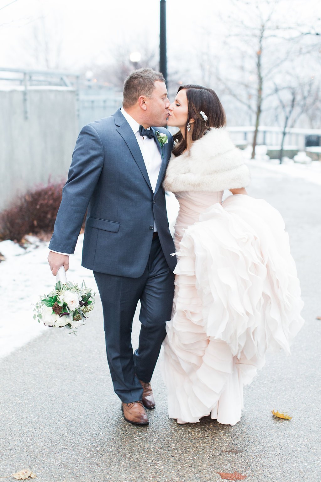 Pittsburgh Wedding Photography - Lauren Renee Photography Portrait of groom grabbing bride's waist showing wedding ringBride and Groom portraits in the Southside during winter wedding