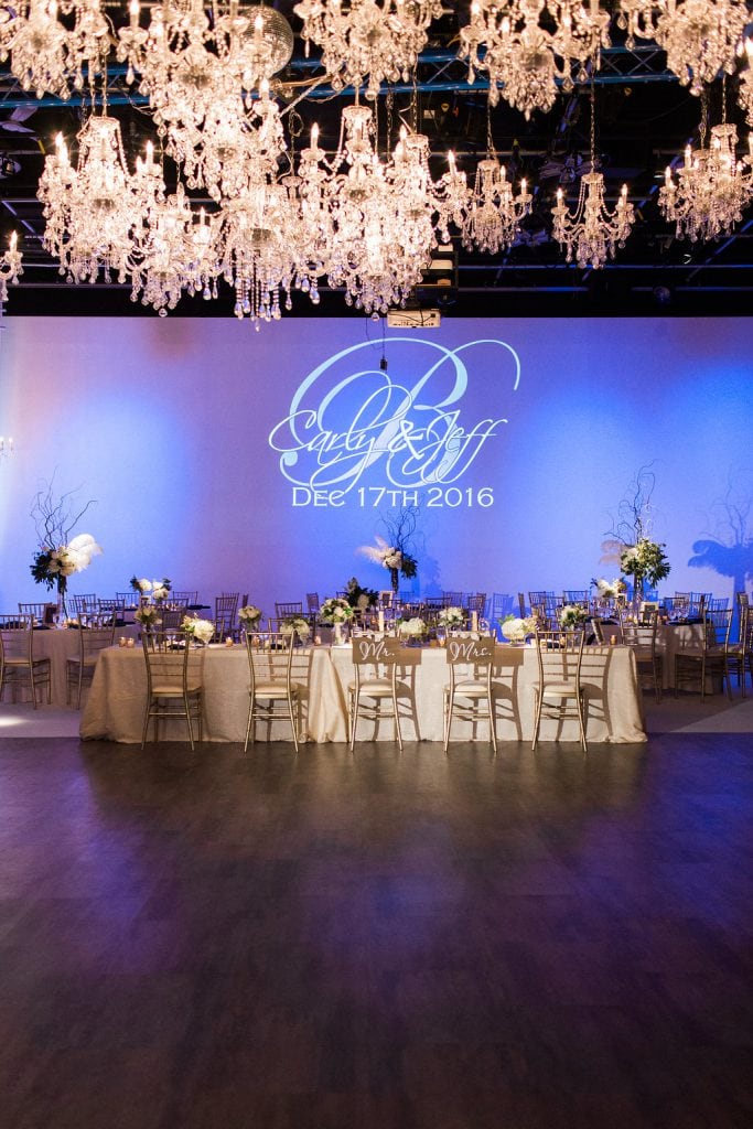 Gold and Navy blue accents with chandeliers and blue uplighting at J. Verno Studios