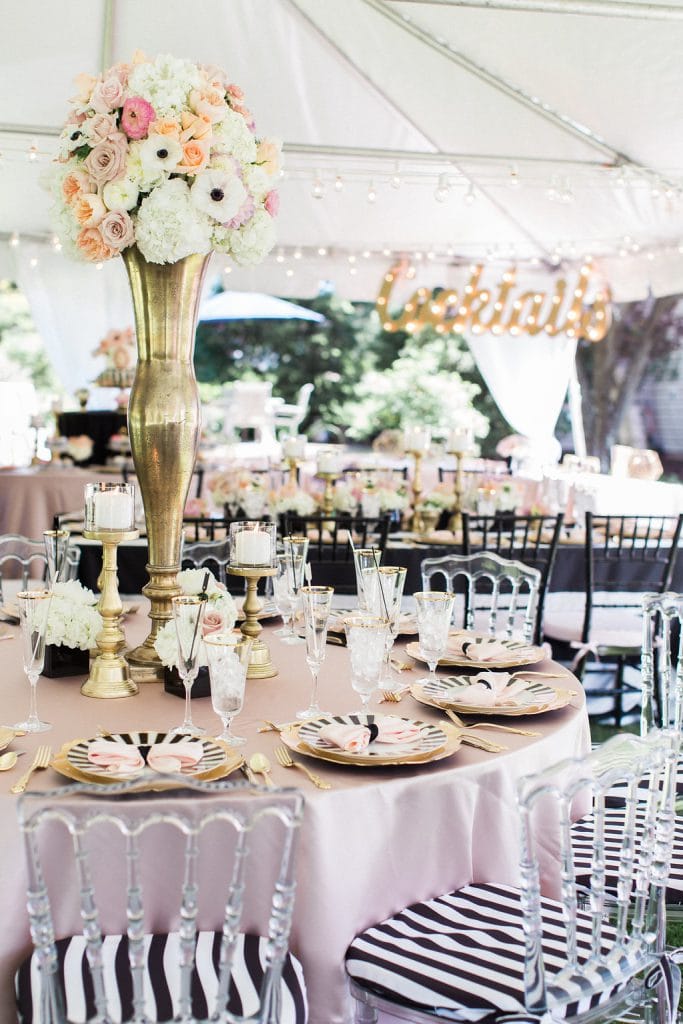 black and white with pink and gold accent bridal shower under white tent in backyard