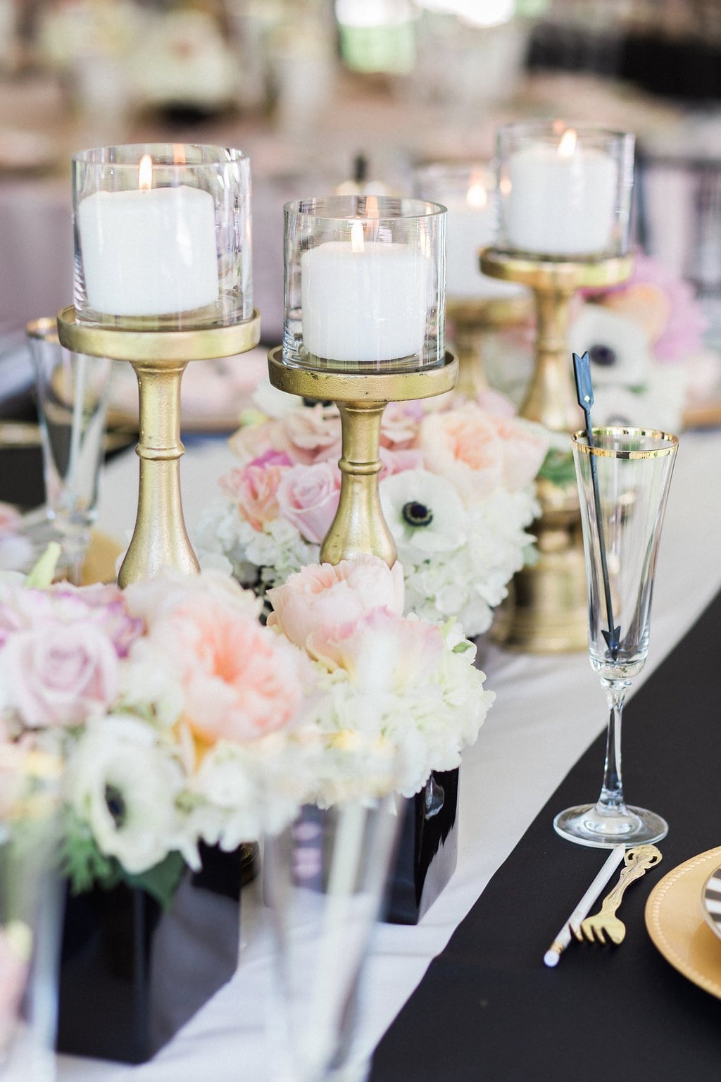 Bridal Shower - Lauren Renee Photography gold candle holders on black and white table cloth with pink and white flowers