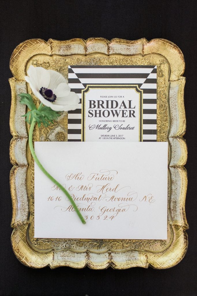 black and white bridal shower invitations on gold antique tray