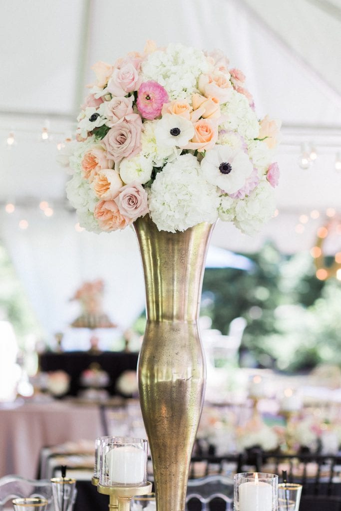 pink and white tall floral arrangements in gold vases