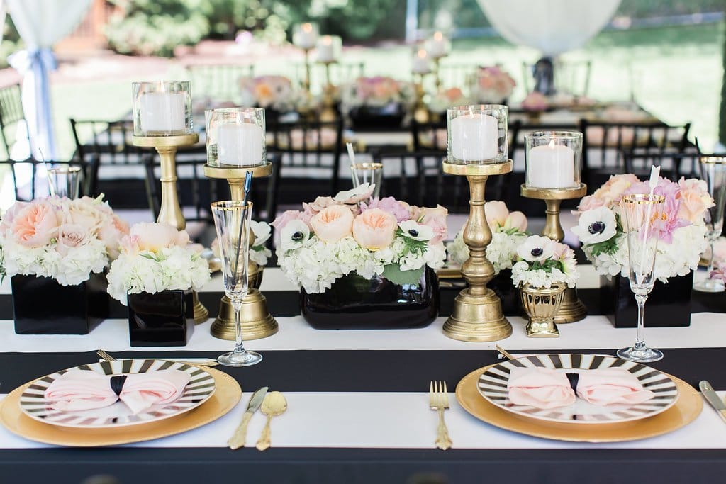 Bridal Shower - Lauren Renee Photography table place setting with candles and flowers on black and white table cloth