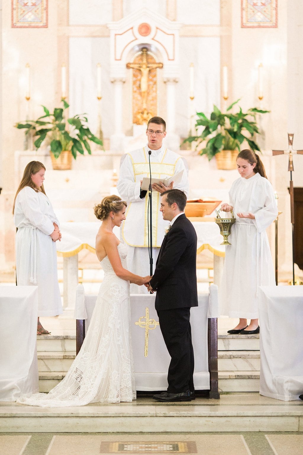 Bride is walked down the aisle by man who received her father's donated heart - Lauren Renee Photography Bride and groom exchange rings at their wedding ceremony