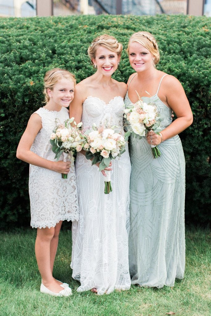 Bride with flower girl and bridesmaid in Adrianna Papell