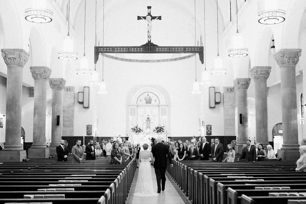 Bride is walked down the aisle by man who received her father's donated heart - Lauren Renee Photography Bride walking down the aisle in black and white at St. Anselm Catholic Church